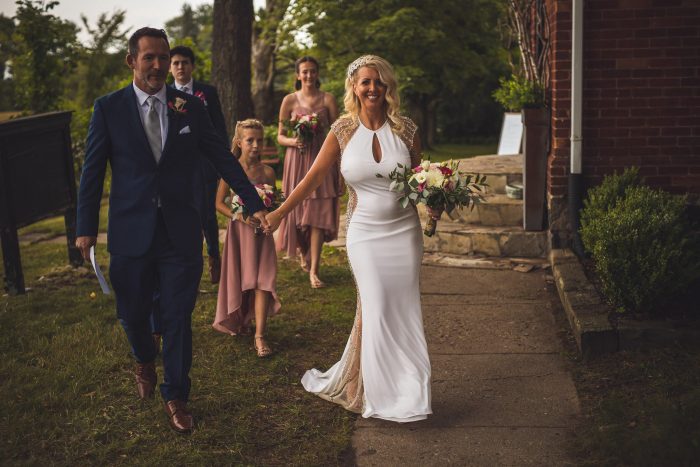 Bride and groom holding hands