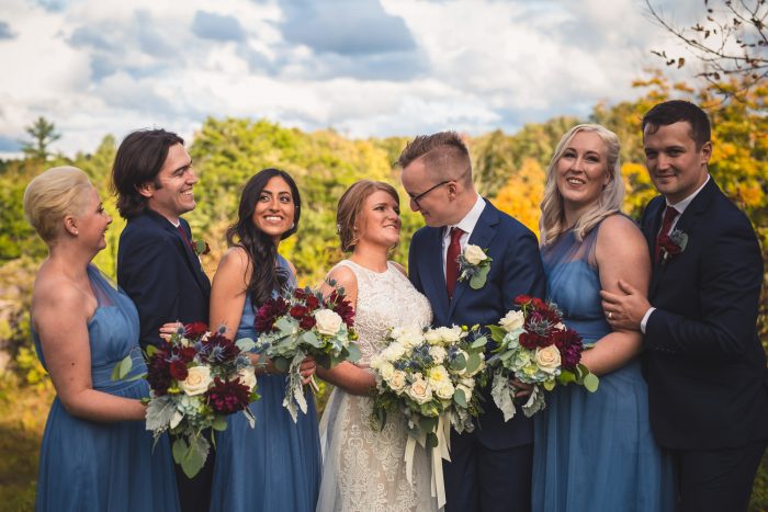 Wedding party smiling and laughing together
